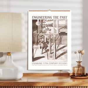 Può includere: Un calendario da parete con la scritta "ENGINEERING THE PAST" e "STUNNING 17TH-CENTURY DESIGNS". Il calendario presenta un'illustrazione color seppia di un design del XVII secolo. Una lampada e un vaso sono visibili in primo piano.