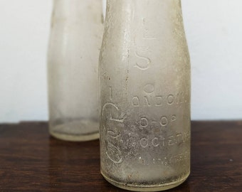 Antique glassware - set of two original antique milk bottles - United Dairies and London Cooperative Society