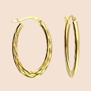 Yellow gold plated textured oval creole hinged hoop earrings