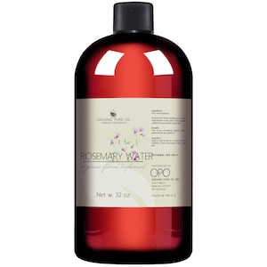 May include: A 32-ounce bottle of rosemary water, labeled "Rosemary Water organic floral hydrosol" with a green label and a red bottle. The bottle is labeled "Organic Pure Oil Embrace Your Beauty" and "Distributed by OPO Organic Pure Oil Inc."