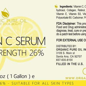 May include: A yellow and white label with the text "ORGANIC PURE OIL" and "VITAMIN C SERUM EXTRA STRENGTH 26%". The label also includes a QR code and the text "Net w. 128 oz (1 Gallon) e EXTRA STRENGTH 26% - SUITABLE FOR ALL SKIN TYPES".