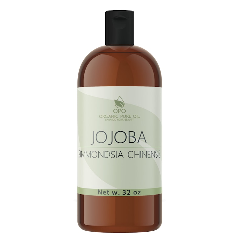 May include: A brown glass bottle with a black cap and a white label. The label says "OPO Organic Pure Oil Embrace Your Beauty" and "Jojoba Simmondsia Chinensis". The bottle contains 32 ounces of jojoba oil.