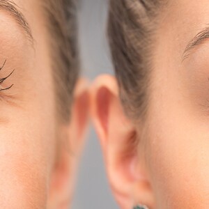 May include: Close-up of two eyes, one with visible wrinkles under the eye and the other without wrinkles. Both eyes have long eyelashes and blue irises.