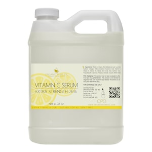 May include: A large, clear plastic bottle of Vitamin C Serum, labelled "Organic Pure Oil" and "Extra Strength 26%". The bottle is 32 fluid ounces and is suitable for all skin types.