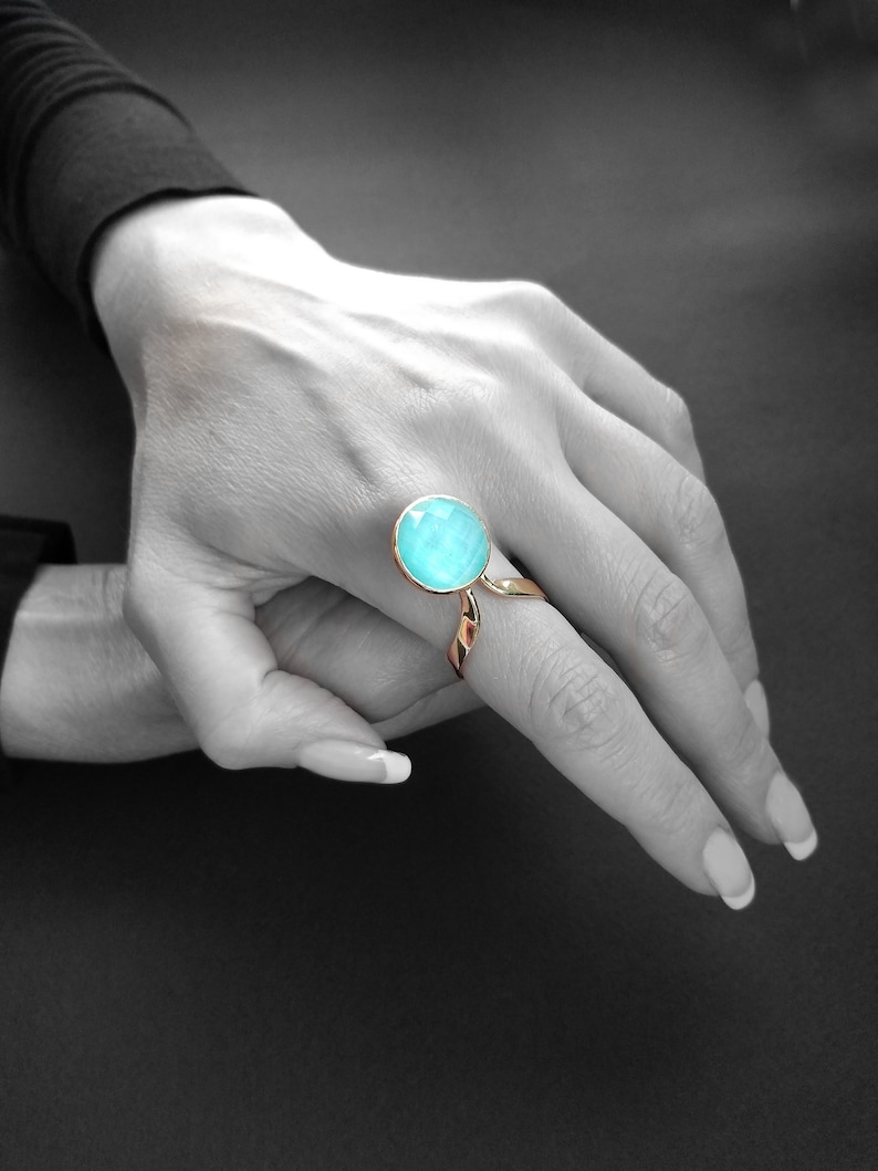 Handmade unique jewelry ring with blue round shaped aquamarine stone