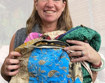 Large zip up recycled wash bag with 4 internal pockets. Wide range of colours. Made from recycled saris. Eco friendly wash bags.