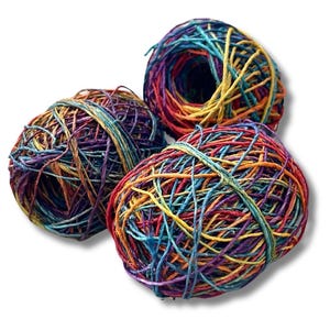 May include: Three balls of colorful string, each wound into a ball shape. The string is a mix of red, orange, yellow, green, blue, purple, and brown.