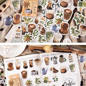 Peut inclure: Un ensemble de 30 autocollants sur le thème du café avec des illustrations de tasses à café, de grains de café, de plants de café et d'équipements de préparation du café. Les autocollants sont imprimés sur du papier blanc et ont une finition mate. Les autocollants sont parfaits pour ajouter une touche de fantaisie à votre agenda, votre journal ou votre ordinateur portable.