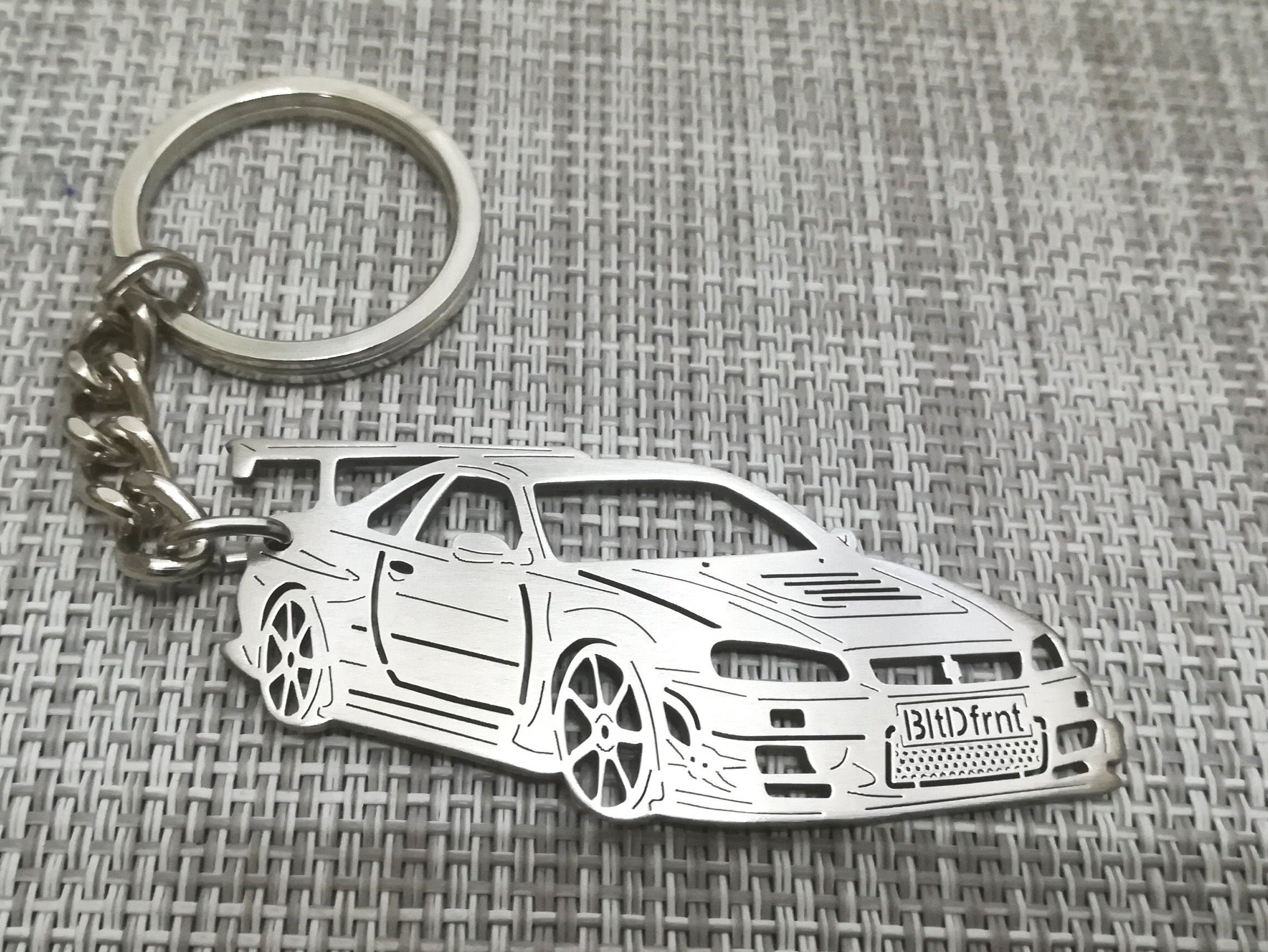 Ключ skyline r34. Брелок скайлайн. Брелоки nissan gtr r34. Брелок skyline машинка. Брелок скайлайн.
