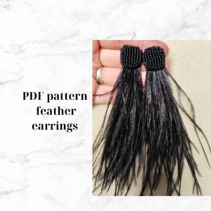 May include: A pair of black feather earrings with black beaded tops. The earrings are shown in a hand holding them. The text "PDF pattern feather earrings" is visible in the image.