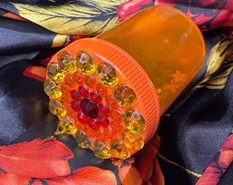 Oranje bedazzled pillenfles: sprankelende reisvoorraadpot