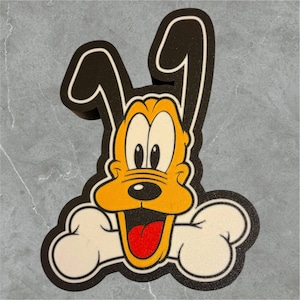 May include: A cartoon illustration of Pluto, a yellow dog with black ears, holding a white bone in his mouth. Pluto has a big smile and his tongue is sticking out.