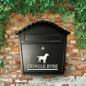 May include: Black metal mailbox with a white silhouette of a dog and the text "Cringle Byre".