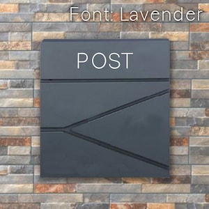 May include: A gray metal mailbox with the word "POST" in white lettering on the front. The mailbox has a geometric design with a triangular shape.
