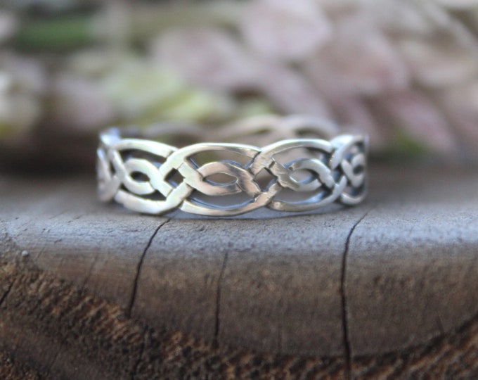 Sterling Silver Band ring . Available size  12.5