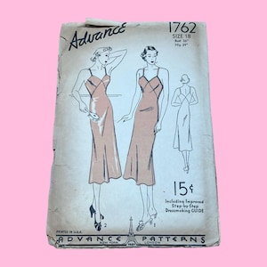 May include: Vintage Advance Patterns sewing pattern envelope. The envelope features illustrations of a woman in a slip dress. The text includes "SIZE 18", "Bust 36", "Hip 39", and "15¢". The envelope is printed in the USA.