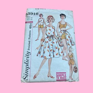 May include: Vintage Simplicity printed pattern 3916. The pattern features illustrations of women's clothing, including a dress and shorts set. The pattern is white with red and orange polka dots. The text "SIMPLE TO MAKE" is visible.