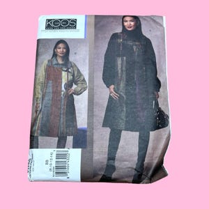 May include: A vintage sewing pattern by Koos Couture. The pattern features a woman wearing a long coat and a dress. The pattern includes the size range of 8-10-12-14. The pattern is printed on paper and has a pink background.
