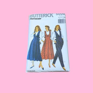 May include: A Butterick 5000 Fast & Easy sewing pattern envelope featuring illustrations of three different garment styles: a solid blue dress, a patterned red dress, and a dark blue patterned jumpsuit, all worn over white long-sleeve shirts.