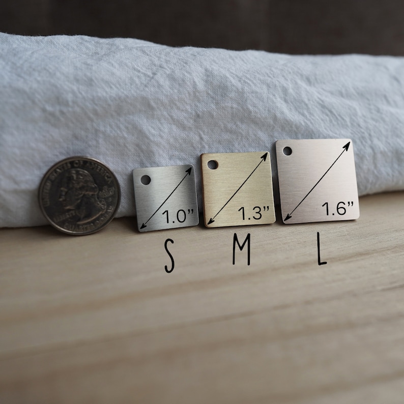 May include: Three square metal tags in different sizes, labeled "S", "M", and "L". The tags are 1.0", 1.3", and 1.6" wide, respectively.