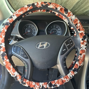 Funda para volante con estampado de vaca marrón y negra y funda para cinturón de seguridad