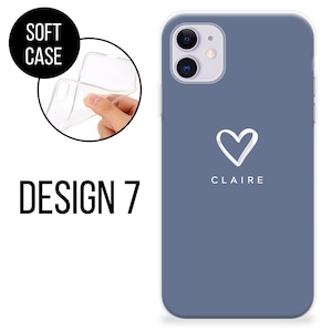 May include: A soft phone case in Design 7, shown in a close-up view. The case is a muted blue with a white heart and the name "CLAIRE" printed below. The words "SOFT CASE" are in a black circle, and "DESIGN 7" is printed in large black letters.