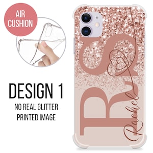 May include: A clear phone case with a rose gold glitter design and the name "Rachel" written in cursive. The case has a raised edge around the camera lens and a soft, flexible feel.