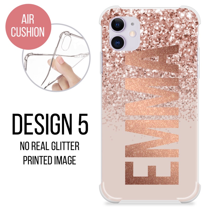 May include: A clear phone case with a rose gold glitter design and the name "EMMA" printed in a rose gold font. The case has a raised edge for protection and is compatible with most smartphones.