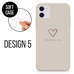 May include: A beige soft phone case with a heart design and the name "Veronica" printed below it. The words "Soft Case" are in a black circle, and "Design 5" is printed in black.