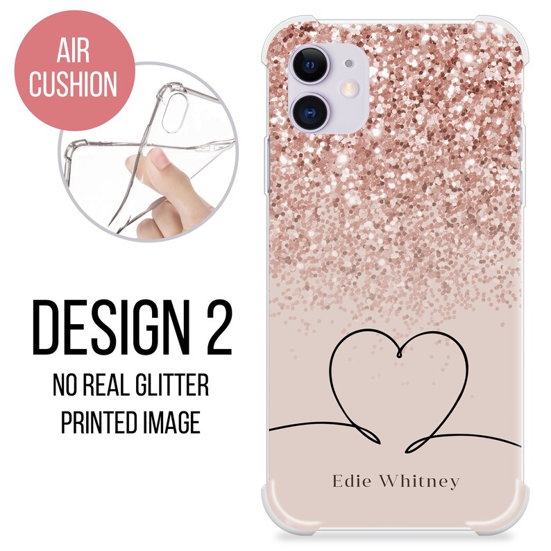 May include: A clear phone case with a rose gold glitter design and a black outline of a heart with the text "Edie Whitney" at the bottom. The case has an air cushion bumper for protection.