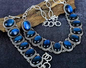 Conjunto de collar y pulsera de labradorita ovalada con destellos azules, chapado en plata