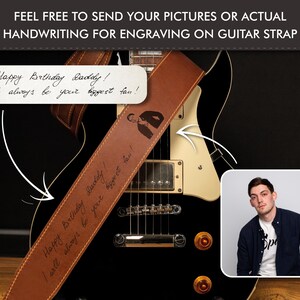 May include: A brown leather guitar strap with engraved text that reads "Happy Birthday Daddy! I will always be your biggest fan!" The strap is draped over a black electric guitar. The image also includes a photo of a man.