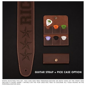 May include: A brown leather guitar strap with the name "RIC" and star designs. Includes a matching pick case with several guitar picks in various colors. The text "GUITAR STRAP + PICK CASE OPTION" is visible.
