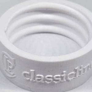 May include: White plastic bottle stopper with the words "Classic Drink" embossed on the side.