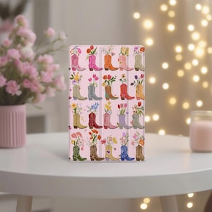 May include: A set of three ceramic mugs with a speckled, matte finish. The mugs are in shades of cream, light gray, and dark gray. Each mug has a simple, minimalist design and a rounded handle.