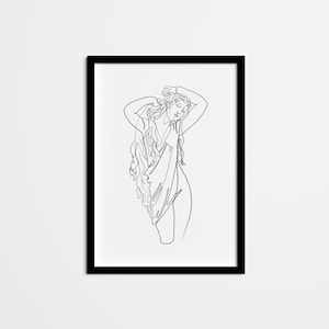 May include: A black and white line drawing of a woman with long hair, wearing a flowing garment. The drawing is framed in a black frame.