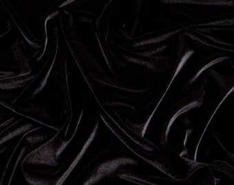 May include: Black velvet fabric with a smooth, soft texture. The fabric is draped and folded, creating a luxurious and elegant look.