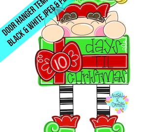 Puede incluir: Un colgador de puerta de cuenta atrás para Navidad verde y rojo con un elfo que sostiene una caja de regalo con un lazo rojo y el texto "10 días para Navidad".