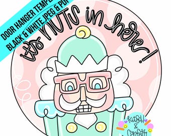 May include: A round door hanger template featuring a cartoon nutcracker with a pink face, green hat, and glasses. The text "It's Nuts in here!" is written in black around the nutcracker. The background is pink with white polka dots.