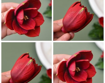 May include: Four close-up images of red artificial flowers made with molds. The flowers are in various stages of bloom, with some fully open and others still in bud form.
