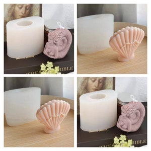 May include: Two silicone moulds for making candles. One mould is shaped like a seashell and the other is shaped like a mermaid. The mermaid mould has a detailed design with a mermaid curled up in a seashell. The seashell mould has a detailed design with a seashell with a pearl-like design.