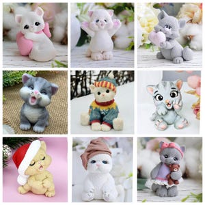 May include: A collection of nine cat figurines in various poses and outfits. The cats are primarily white, gray, and beige, with some wearing hats, sweaters, and holding objects like hearts and teddy bears. The figurines are set against a soft, blurred background.