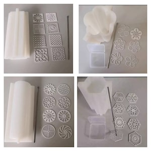 May include: A set of silicone moulds for making decorative soap or candles. The set includes a variety of shapes, including flowers, geometric patterns, and swirls. The moulds are white and come with a metal rod for centering the soap or candle.