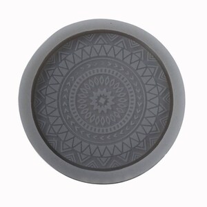 May include: Grey silicone mould with a circular design featuring a geometric pattern. The mould is perfect for creating resin coasters or other decorative items.