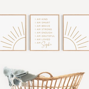 May include: Three framed prints with a gold sunburst design and text that reads "I am kind, I am smart, I am brave, I am strong, I am enough, I am grateful, I am loved, I am Sophie".