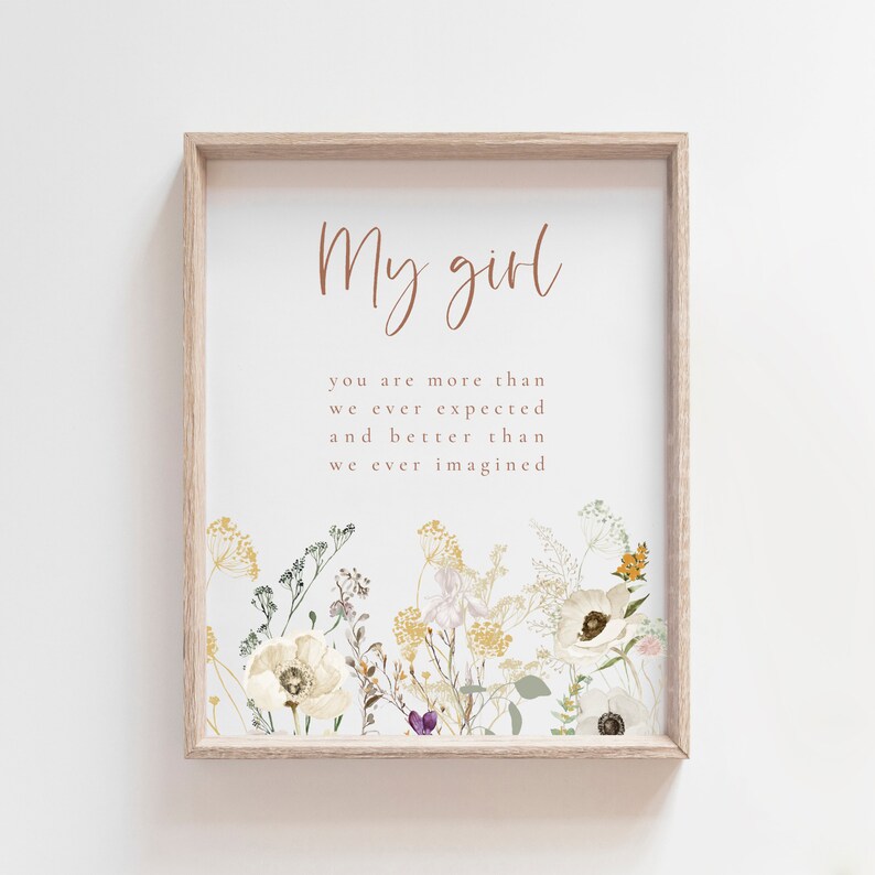 nursery wall art with flowers and an inspirational quote for a baby girl