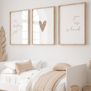 Nursery wall art set of 3 for a baby girl room with the nursery quote Our Darling Girl You Are So Loved