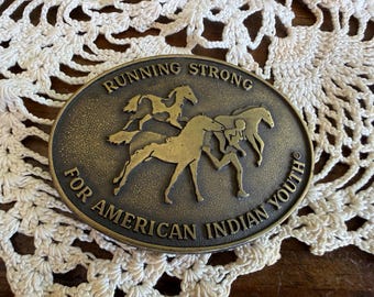 Vintage Running Strong for American Indian youth Large Brass Belt Buckle