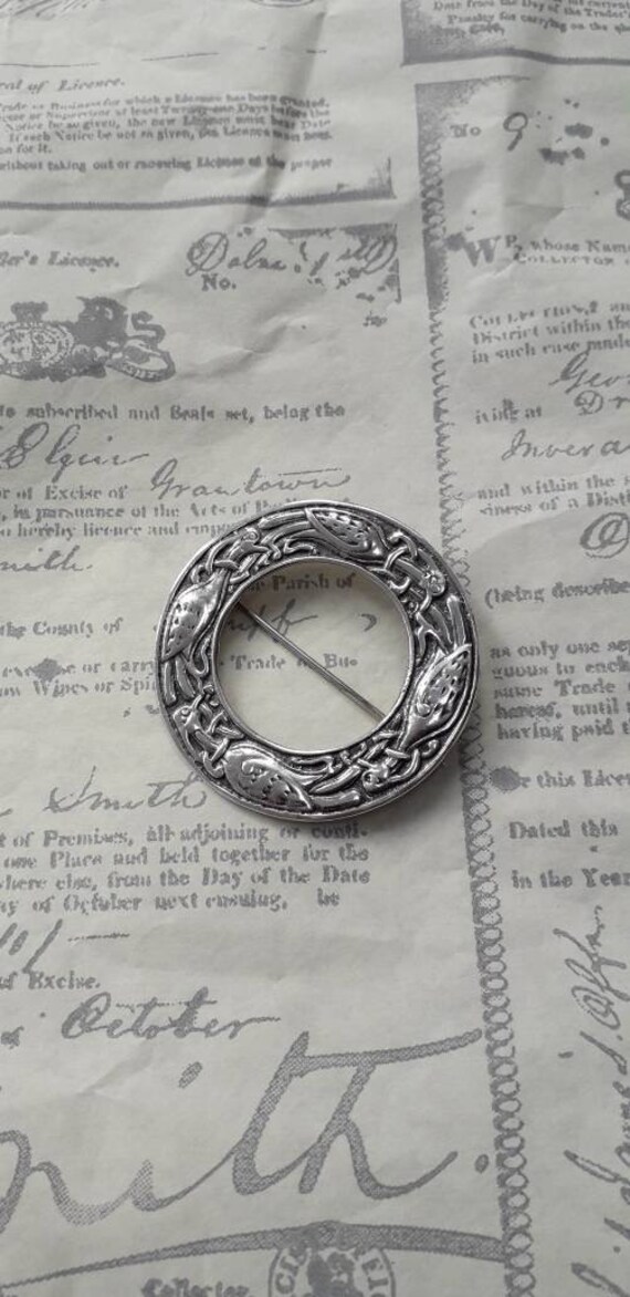 Superb silver cloak pin.