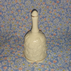 Porcelain Ivory Hand Bell With Raised Roses and Leaves Design and Gold Trim